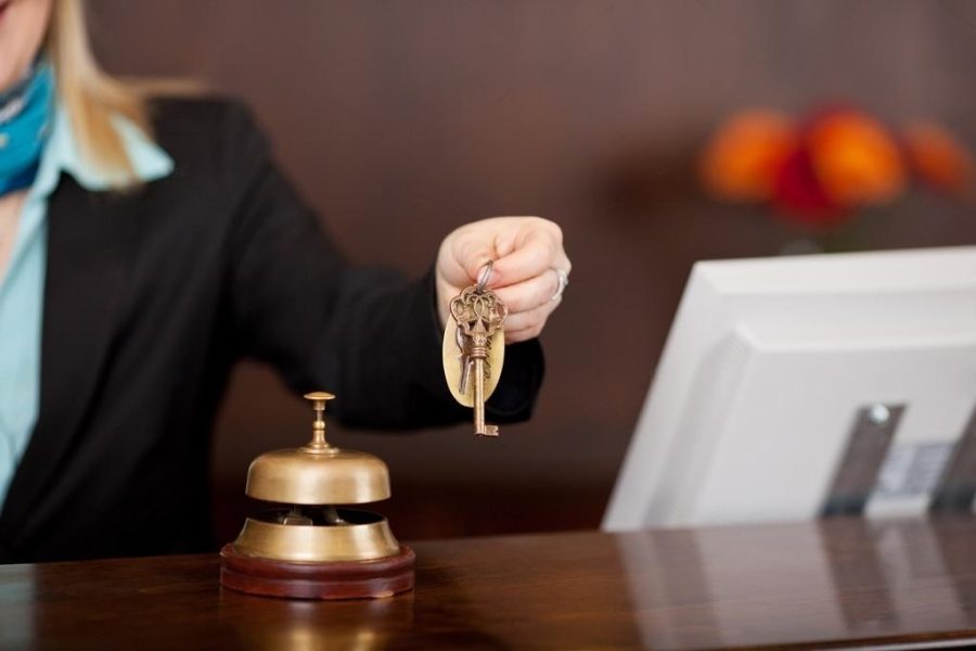 depositphotos_26182459-stock-photo-receptionist-passing-room-keys-transformed